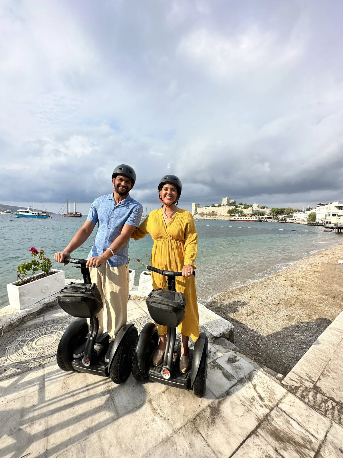 Family with Segway and bicycle, bay view