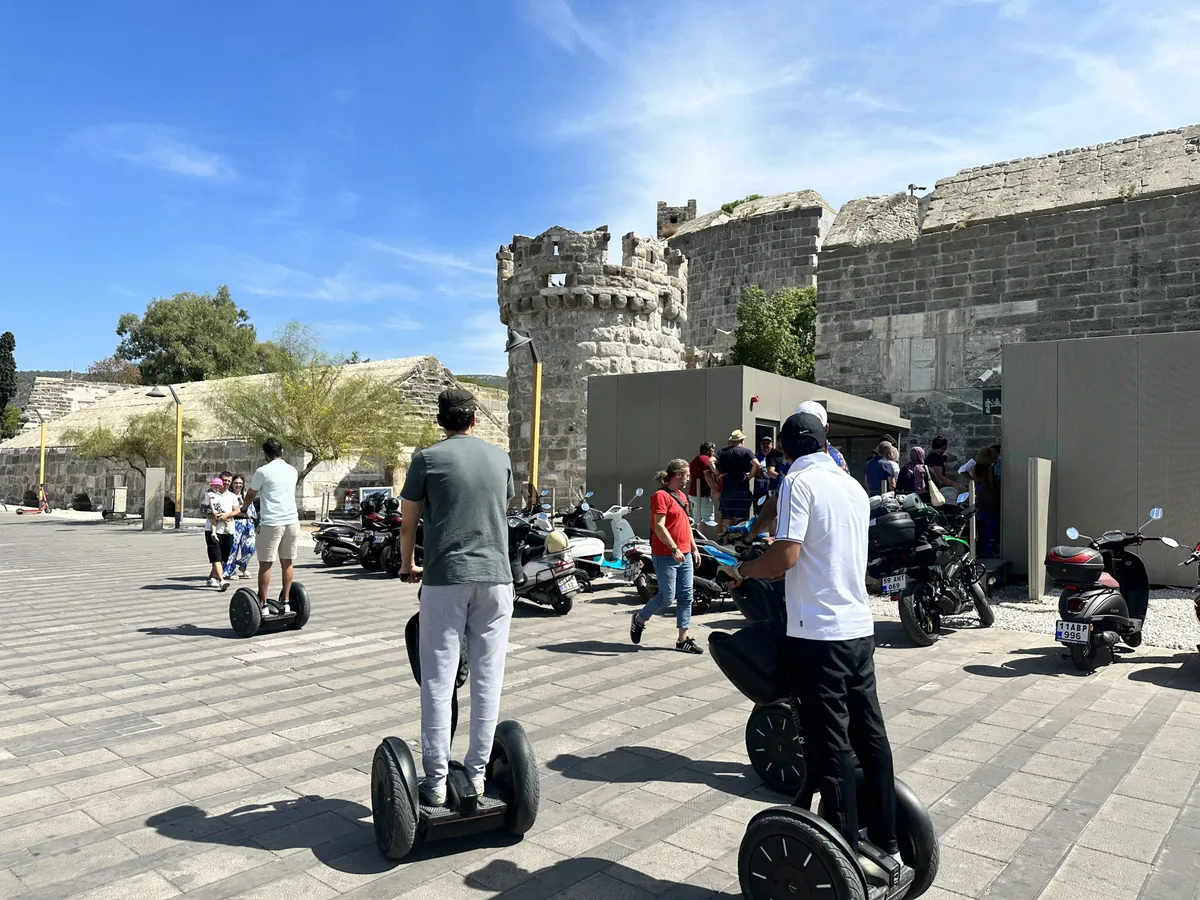 Group of four on Segways in front of Bodrum Castle